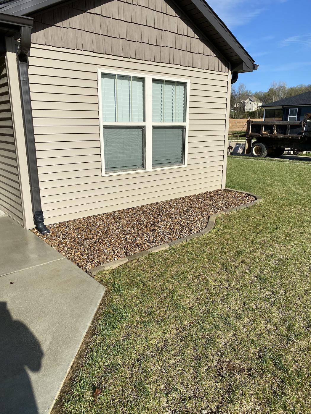 Edged bed along the house